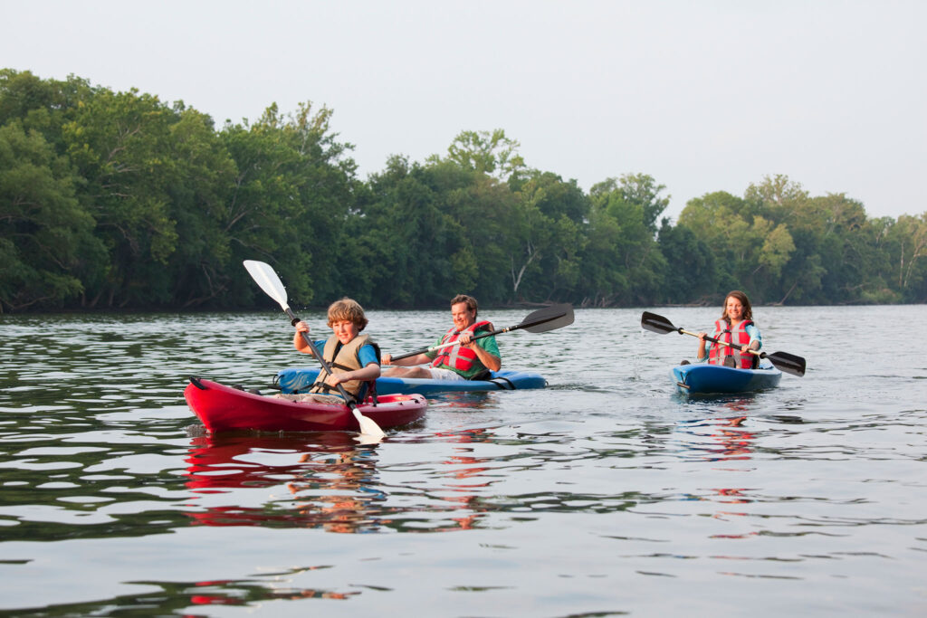 A family kayaks together.